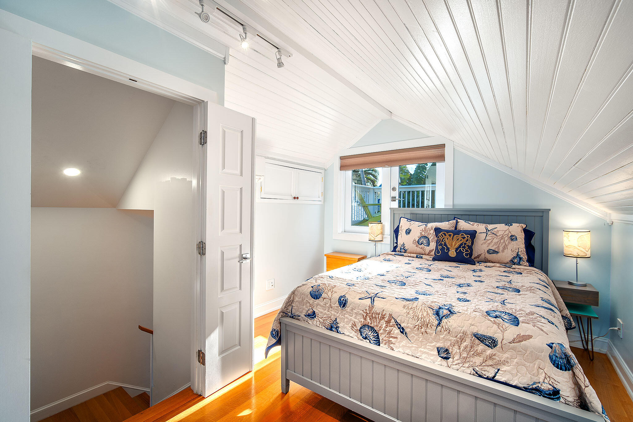 1116 Packer Street Key West, FL 33040 - Photo 42 of 57 a bed sitting in a bedroom next to a window