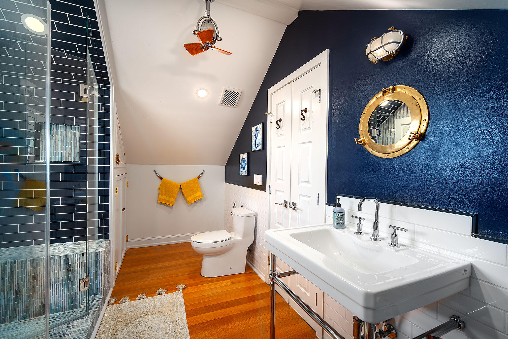 1116 Packer Street Key West, FL 33040 - Photo 45 of 57 a bathroom with a sink a toilet and a mirror