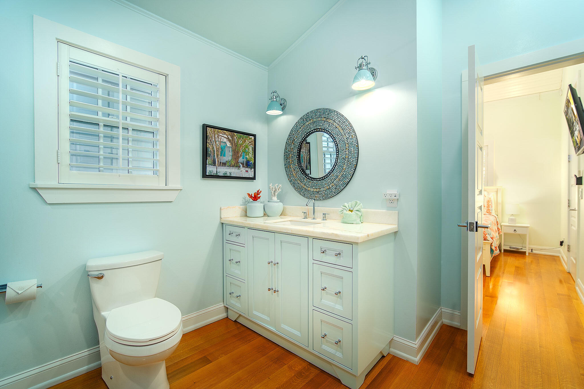 1116 Packer Street Key West, FL 33040 - Photo 49 of 57 a bathroom with a toilet sink and mirror