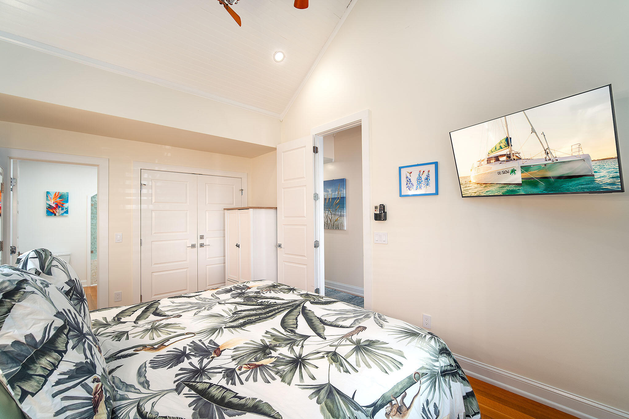 1116 Packer Street Key West, FL 33040 - Photo 51 of 57 a bedroom with a bed and a painting on the wall