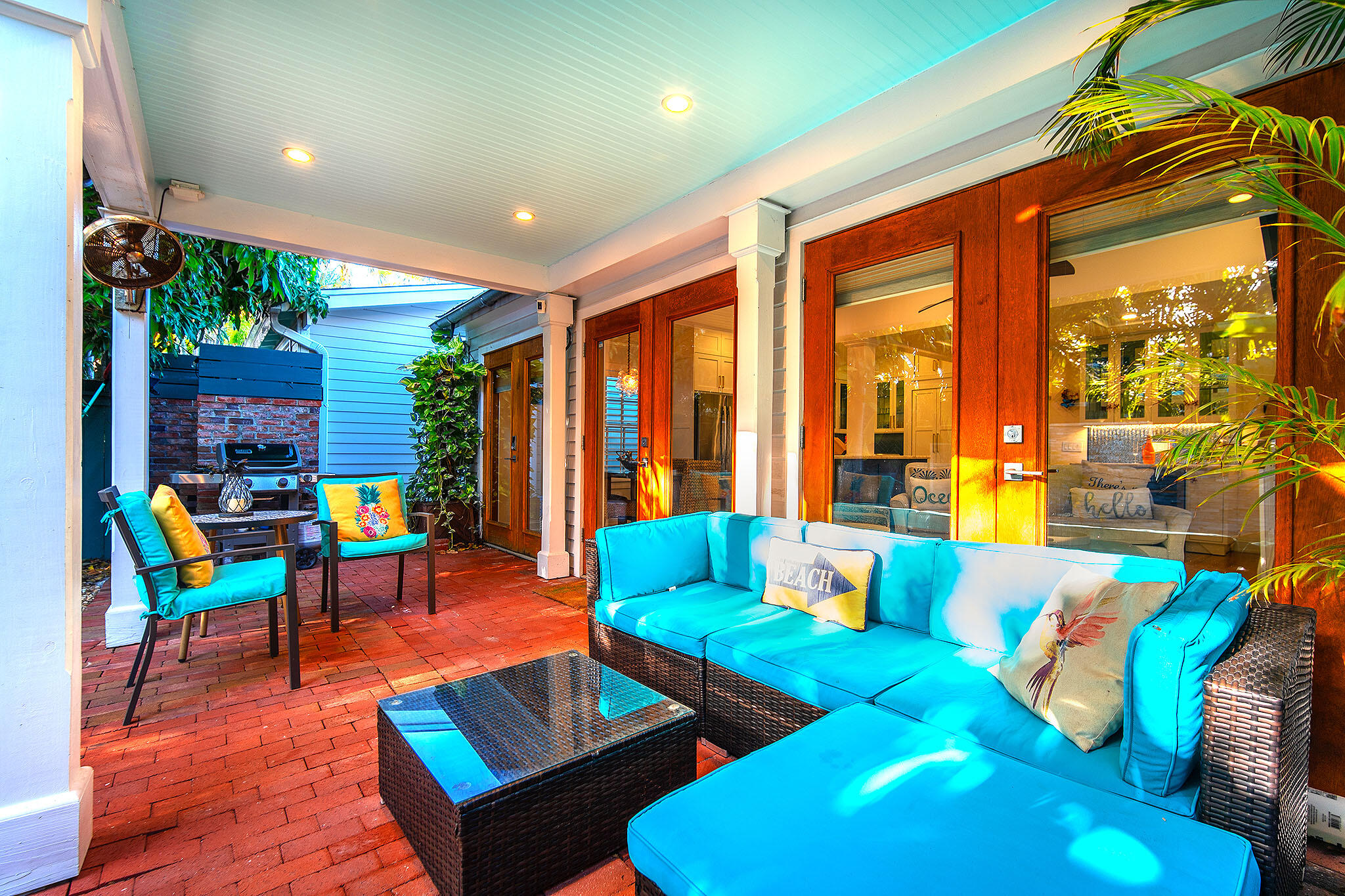 1116 Packer Street Key West, FL 33040 - Photo 10 of 57 a living room with furniture and floor to ceiling windows