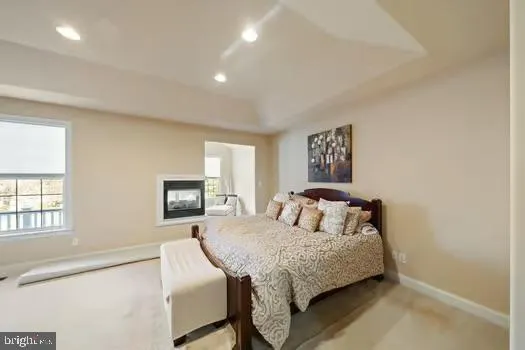 a bedroom with a large bed and a window