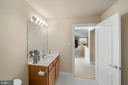 a bathroom with a sink toilet vanity and shower