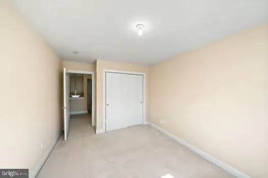 a view of a garage with wooden floor and a window