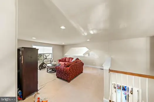a view of a dining room with furniture and a chandelier