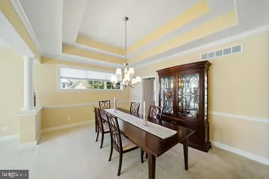 a bed room with a bed and a chandelier