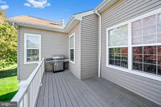 a view of a house with pool and wooden floor