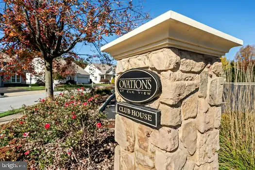 a view of sign board with a yard