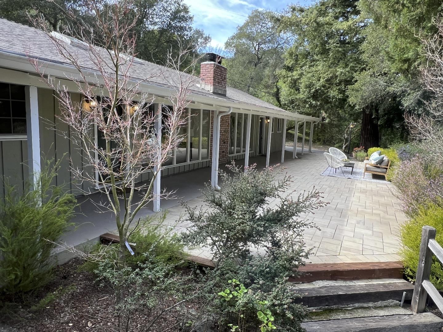 1 Hayfields Road Portola Valley, CA 94028 - Photo 1 of 1 a view of a patio with table and chairs and potted plants