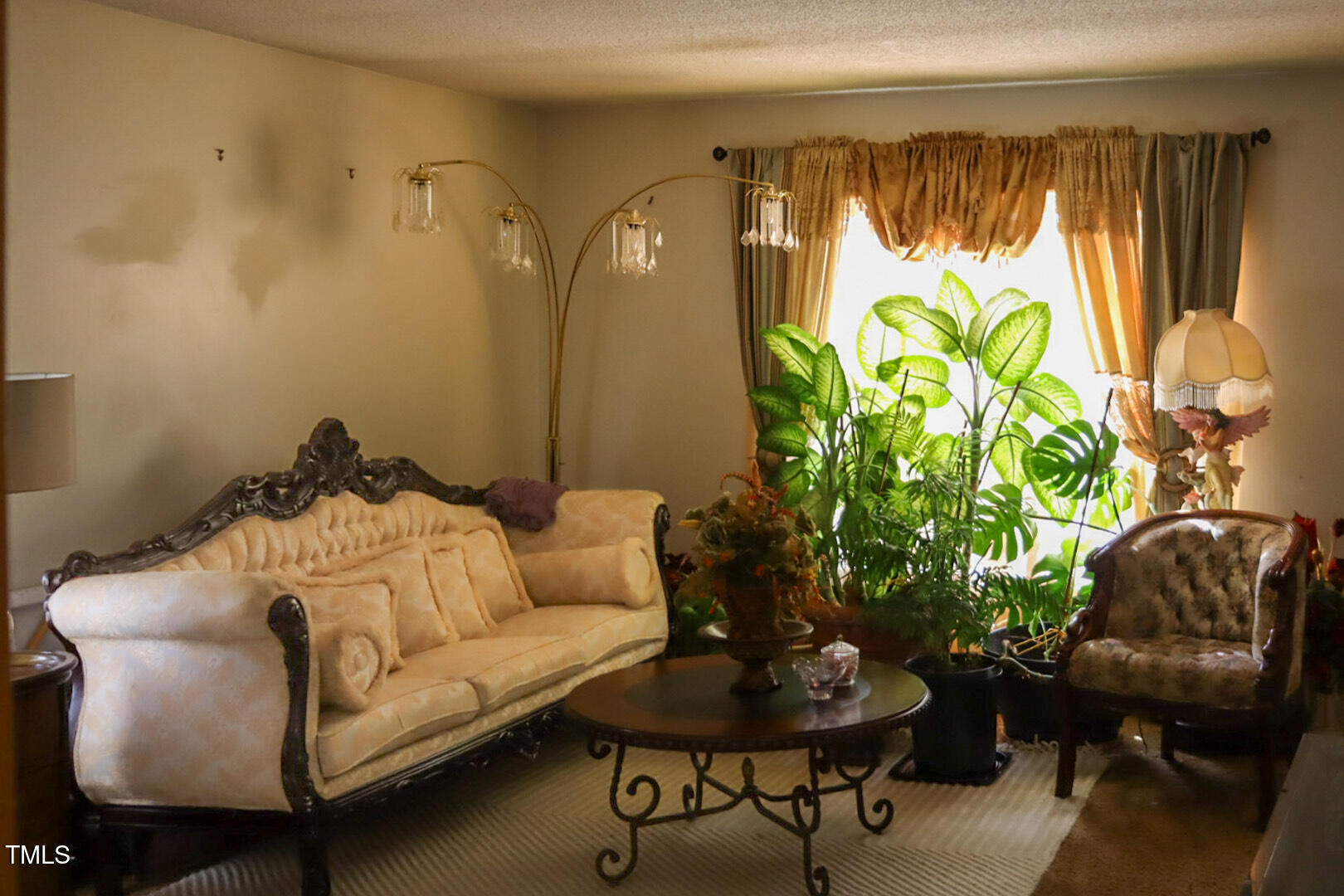 309 Cody Street Durham, NC 27703 - Photo 16 of 22 a living room with furniture and a potted plant