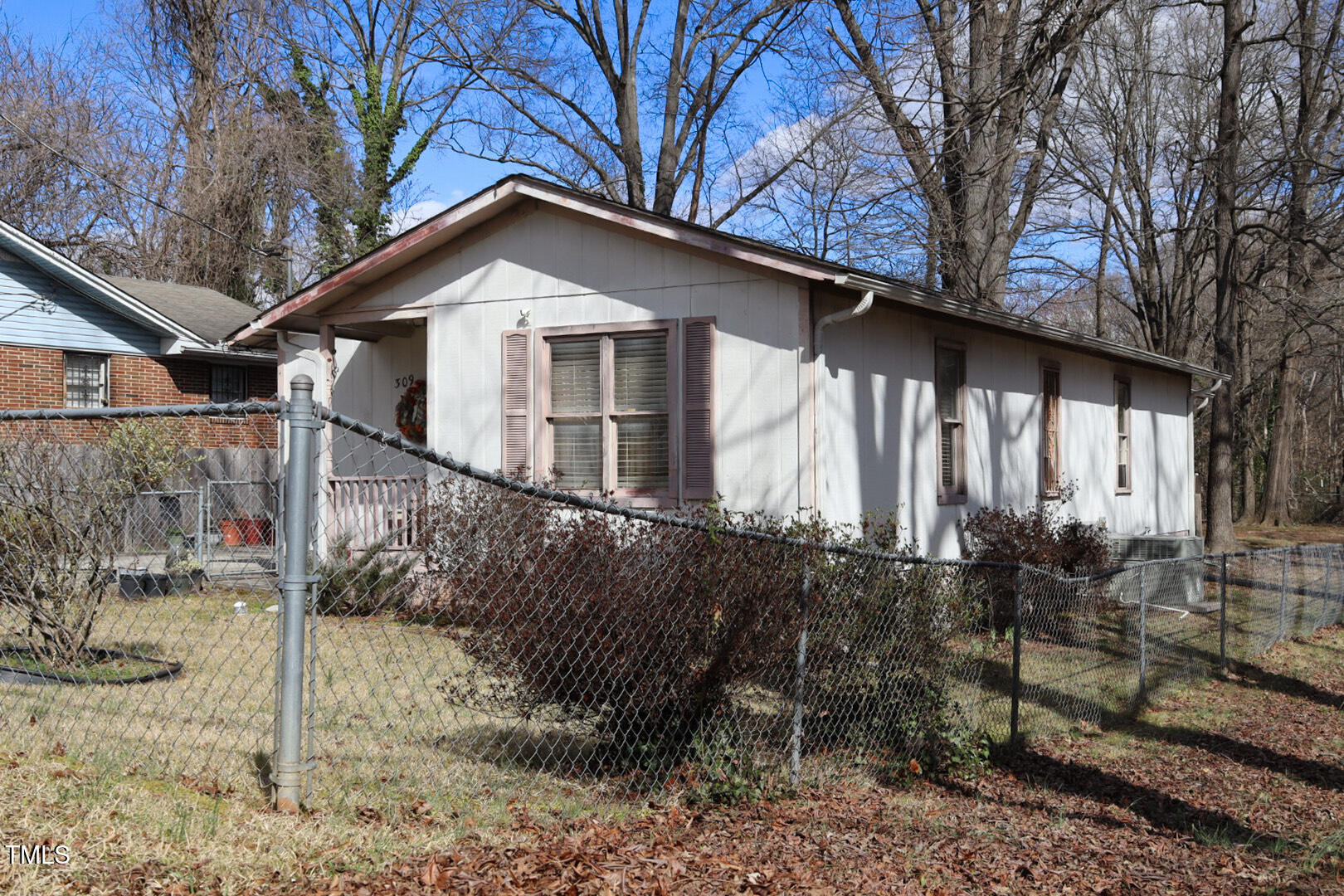 309 Cody Street Durham, NC 27703 - Photo 4 of 22 a view of a house with a yard