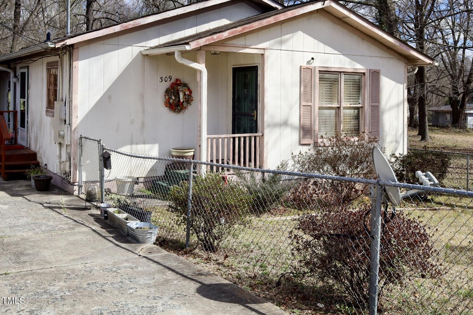 309 Cody Street Durham, NC 27703 - Photo 5 of 22 a front view of a house with garden