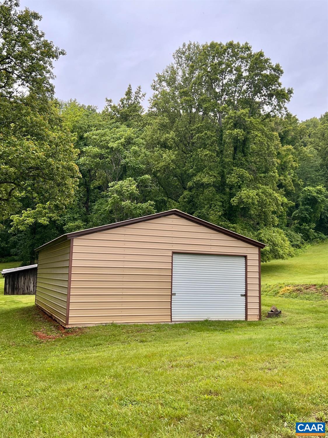 166 Matohe Road Monroe, VA 24574 - Photo 10 of 12 a view of a backyard with large trees