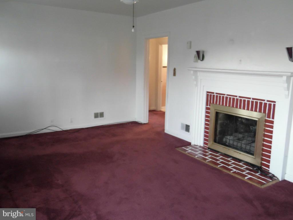 11245 Old Frederick Road Marriottsville, MD 21104 - Photo 2 of 22 a view of empty room with a fireplace