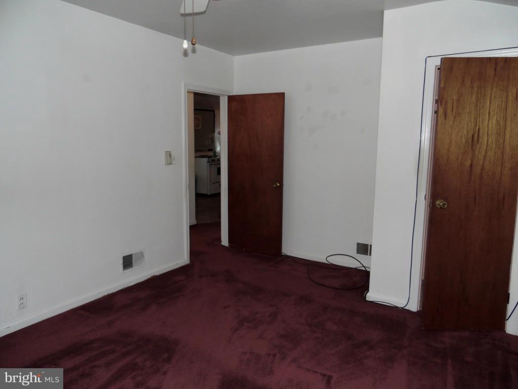 11245 Old Frederick Road Marriottsville, MD 21104 - Photo 12 of 22 an empty room with wooden floor and closet