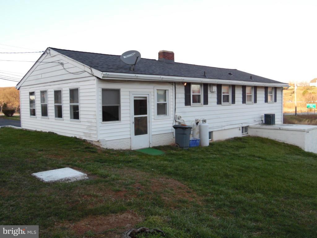 11245 Old Frederick Road Marriottsville, MD 21104 - Photo 19 of 22 a front view of a house with a garden