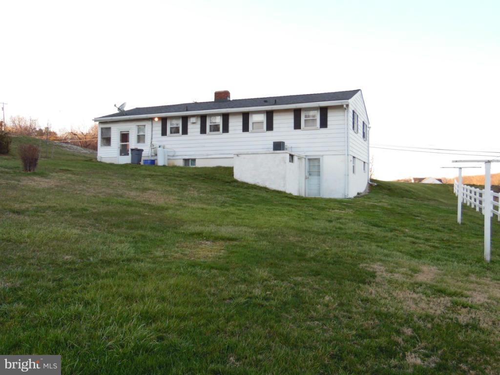 11245 Old Frederick Road Marriottsville, MD 21104 - Photo 21 of 22 a view of a house with a big yard and large trees