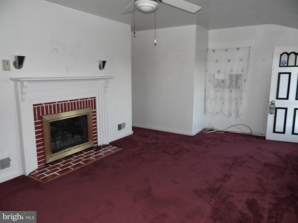 11245 Old Frederick Road Marriottsville, MD 21104 - Photo 4 of 22 a living room with a fireplace