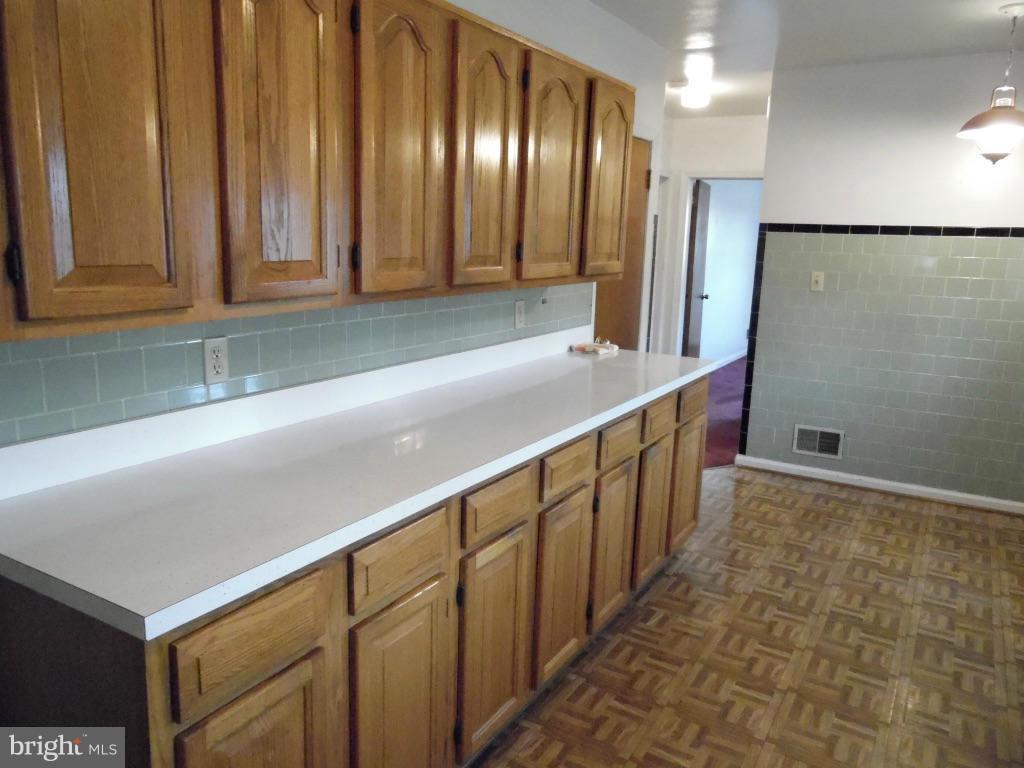 11245 Old Frederick Road Marriottsville, MD 21104 - Photo 9 of 22 a kitchen with stainless steel appliances a sink and cabinets