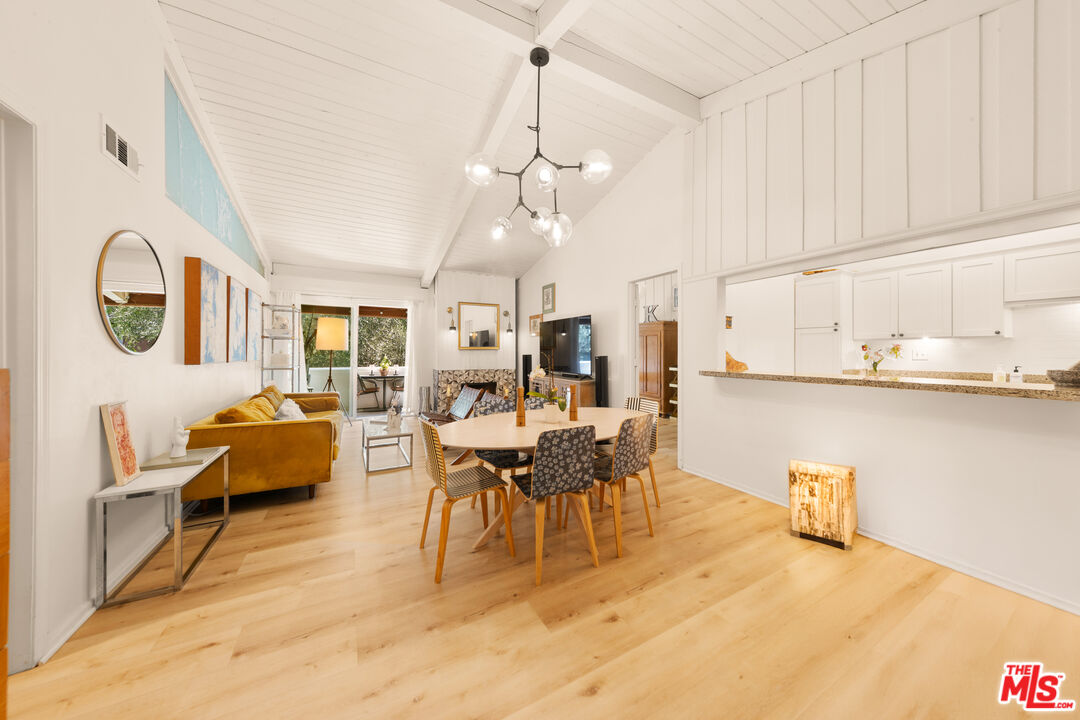 6425 Green Valley Circle, Unit 302 Culver City, CA 90230 - Photo 1 of 34 a dining room with furniture and view of kitchen