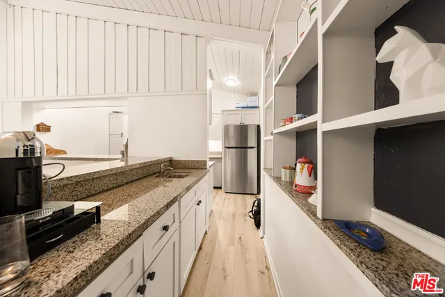 a kitchen with stainless steel appliances granite countertop a stove and a sink