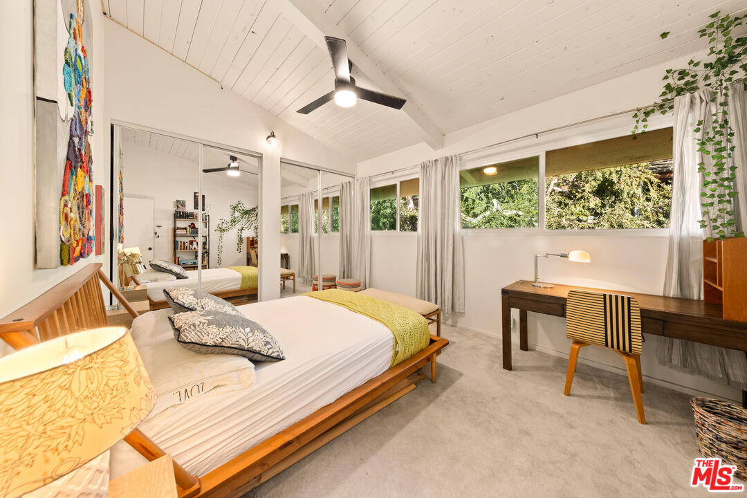 6425 Green Valley Circle, Unit 302 Culver City, CA 90230 - Photo 21 of 34 a bedroom with a bed and a large window