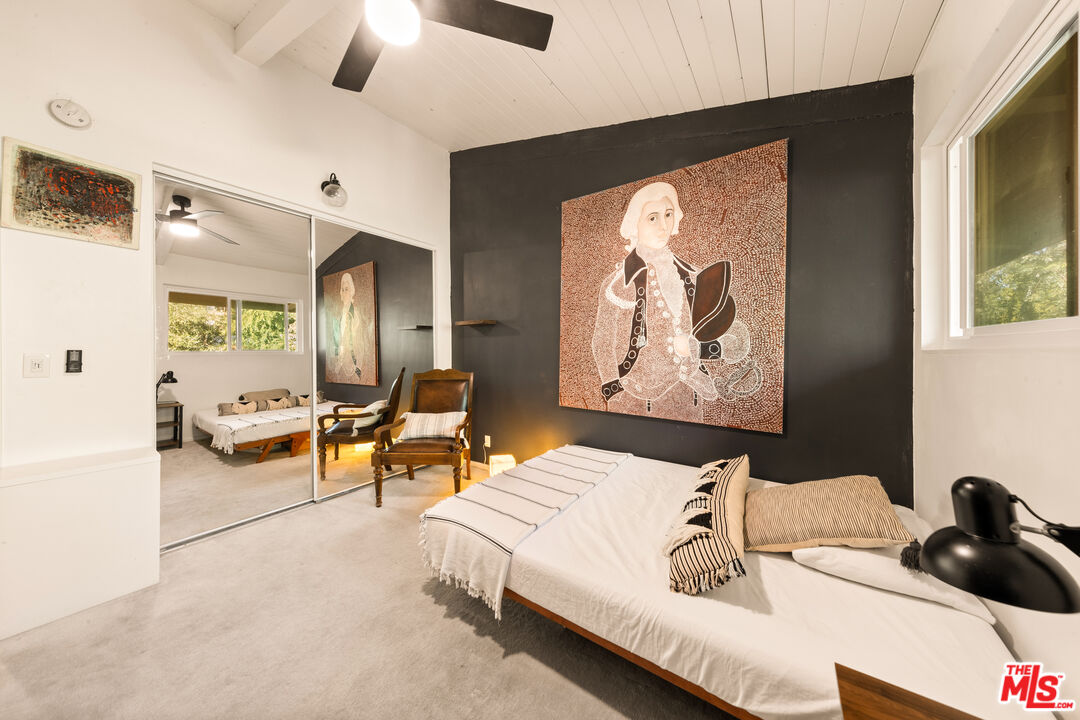 6425 Green Valley Circle, Unit 302 Culver City, CA 90230 - Photo 23 of 34 a living room with furniture and a painting on the wall