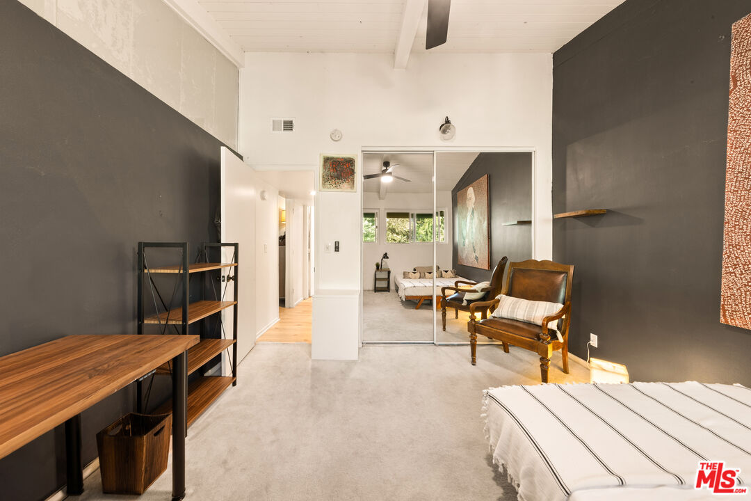 6425 Green Valley Circle, Unit 302 Culver City, CA 90230 - Photo 24 of 34 a living room with furniture a fireplace and a table
