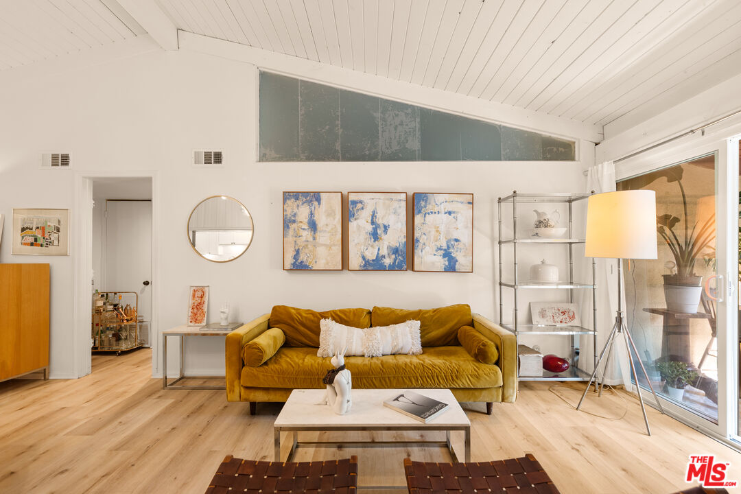 6425 Green Valley Circle, Unit 302 Culver City, CA 90230 - Photo 3 of 34 a living room with furniture and a large window