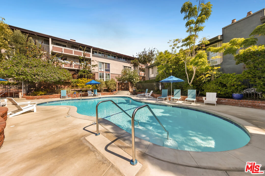 6425 Green Valley Circle, Unit 302 Culver City, CA 90230 - Photo 34 of 34 a swimming pool with outdoor seating and yard