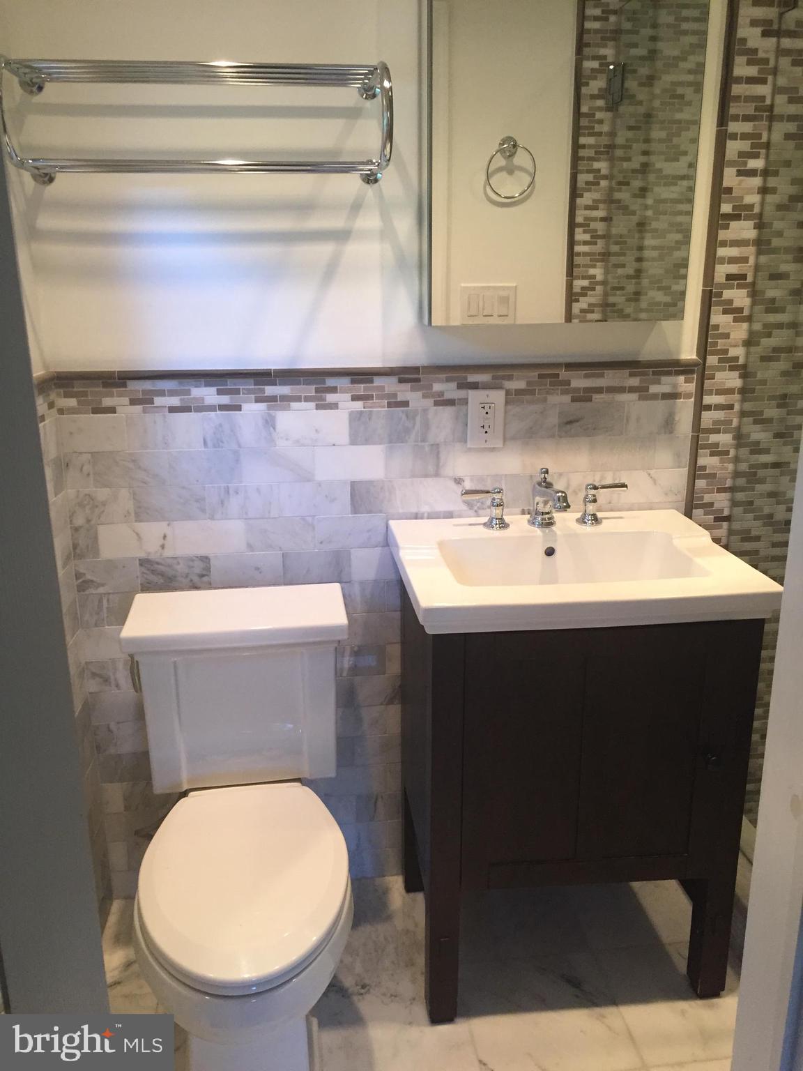 3717 North Glebe Road Arlington, VA 22207 - Photo 14 of 26 a bathroom with a toilet sink and mirror