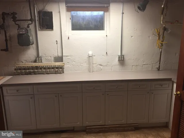 a bathroom with a sink and mirror