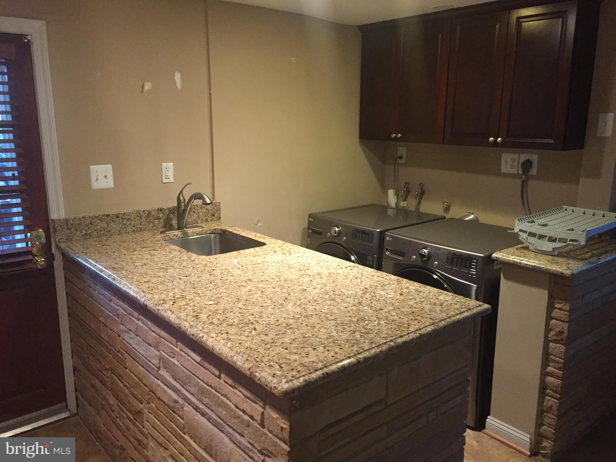 3717 North Glebe Road Arlington, VA 22207 - Photo 21 of 26 a kitchen with granite countertop a sink and a stove