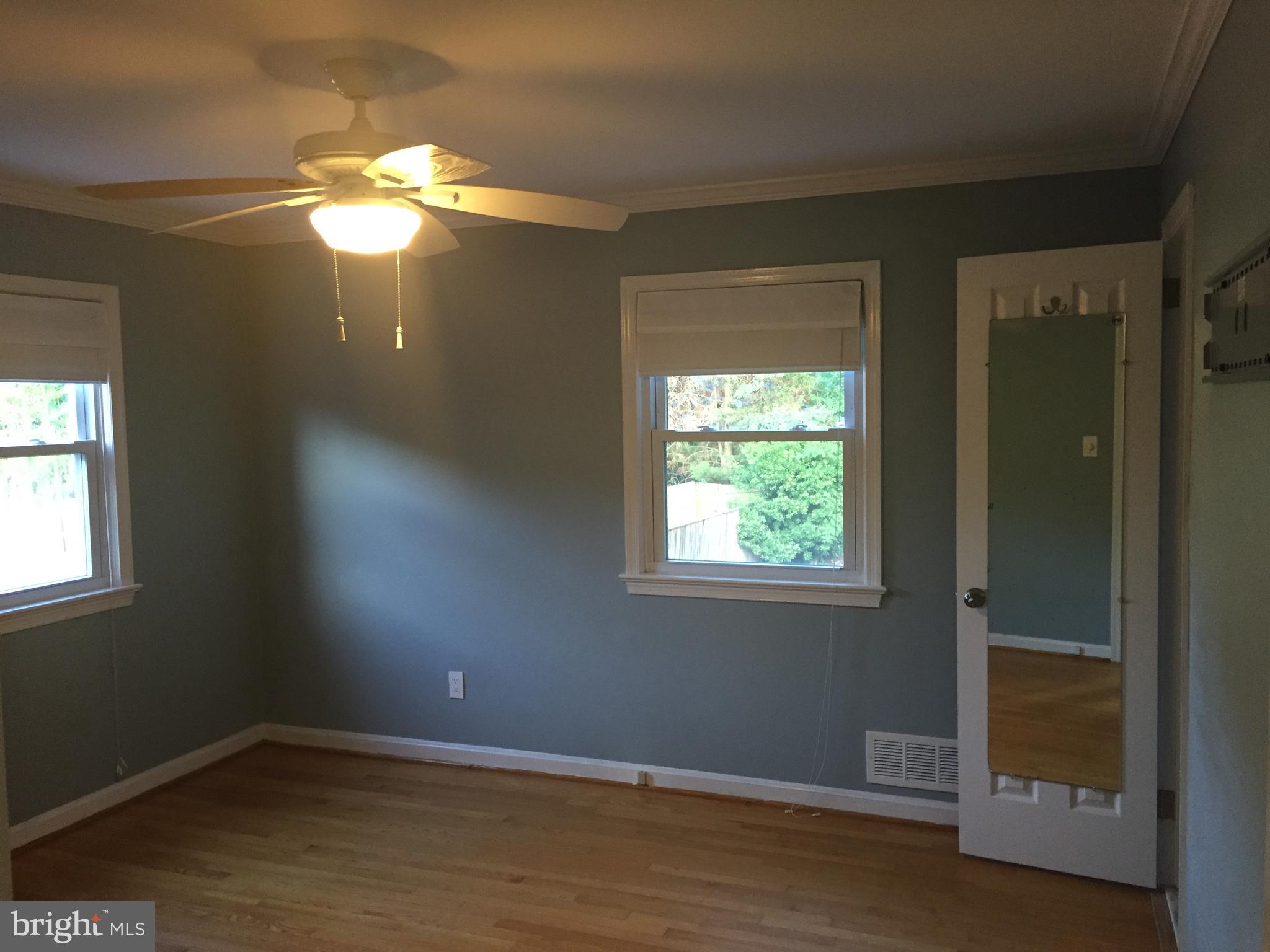3717 North Glebe Road Arlington, VA 22207 - Photo 10 of 26 a view of a livingroom with a chandelier fan and a window
