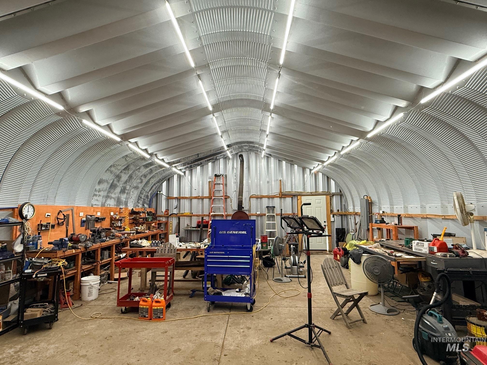 35322 River Road Lenore, ID 83541 - Photo 29 of 42 Quonset hut structure featuring an arched corrugated metal ceiling and concrete flooring