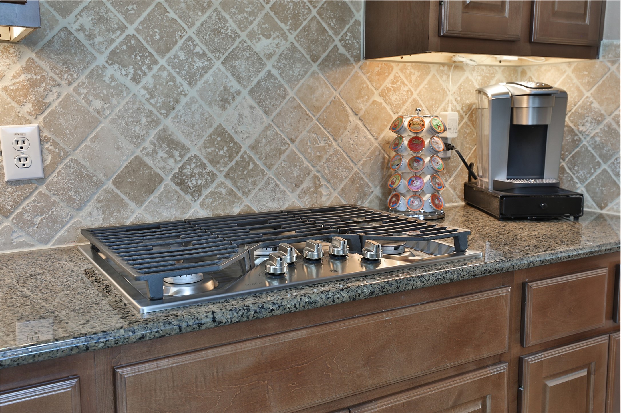 20519 Windrose Bend Drive Spring, TX 77379 - Photo 14 of 37 Kitchen features a five-burner GE gas cooktop, ideal for preparing gourmet meals.