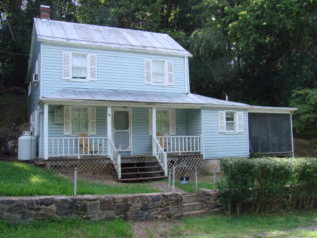 135 Compton Hollow Road Rileyville, VA 22650 - Photo 1 of 1 a front view of a house with a yard