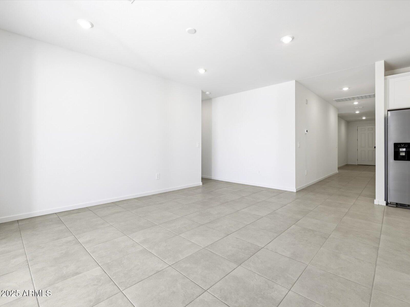 24477 West Grove Street Buckeye, AZ 85326 - Photo 10 of 49 a view of an empty room