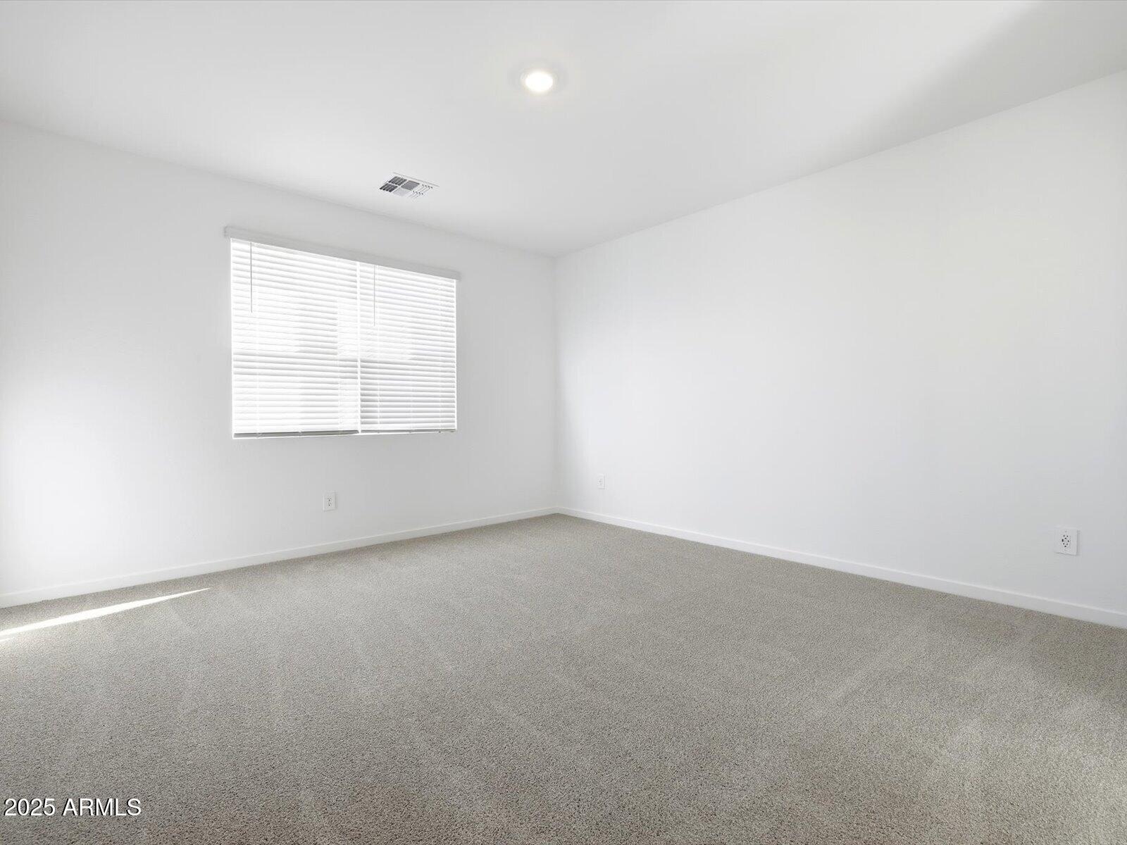 24477 West Grove Street Buckeye, AZ 85326 - Photo 12 of 49 an empty room with a window