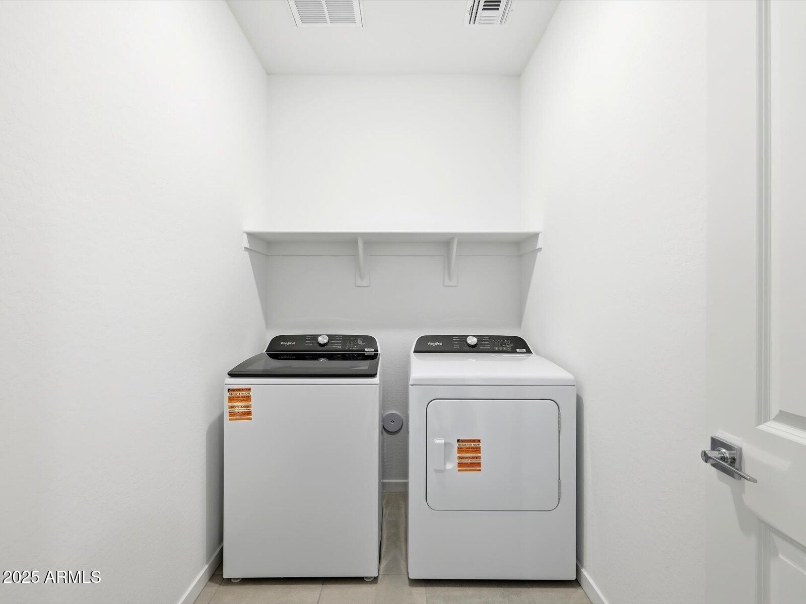 24477 West Grove Street Buckeye, AZ 85326 - Photo 19 of 49 a utility room with dryer and washer