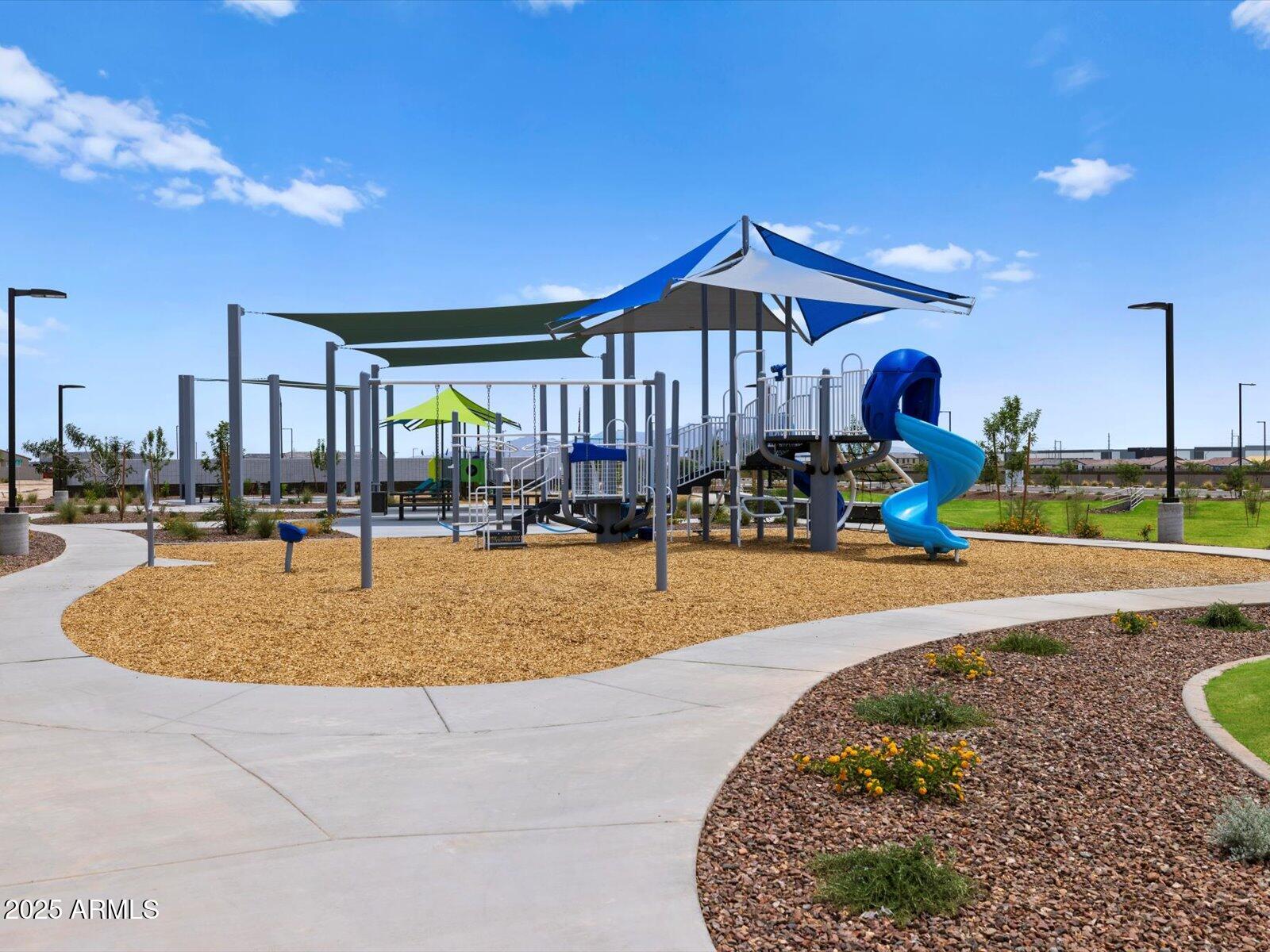24477 West Grove Street Buckeye, AZ 85326 - Photo 40 of 49 a swimming pool with outdoor seating and yard