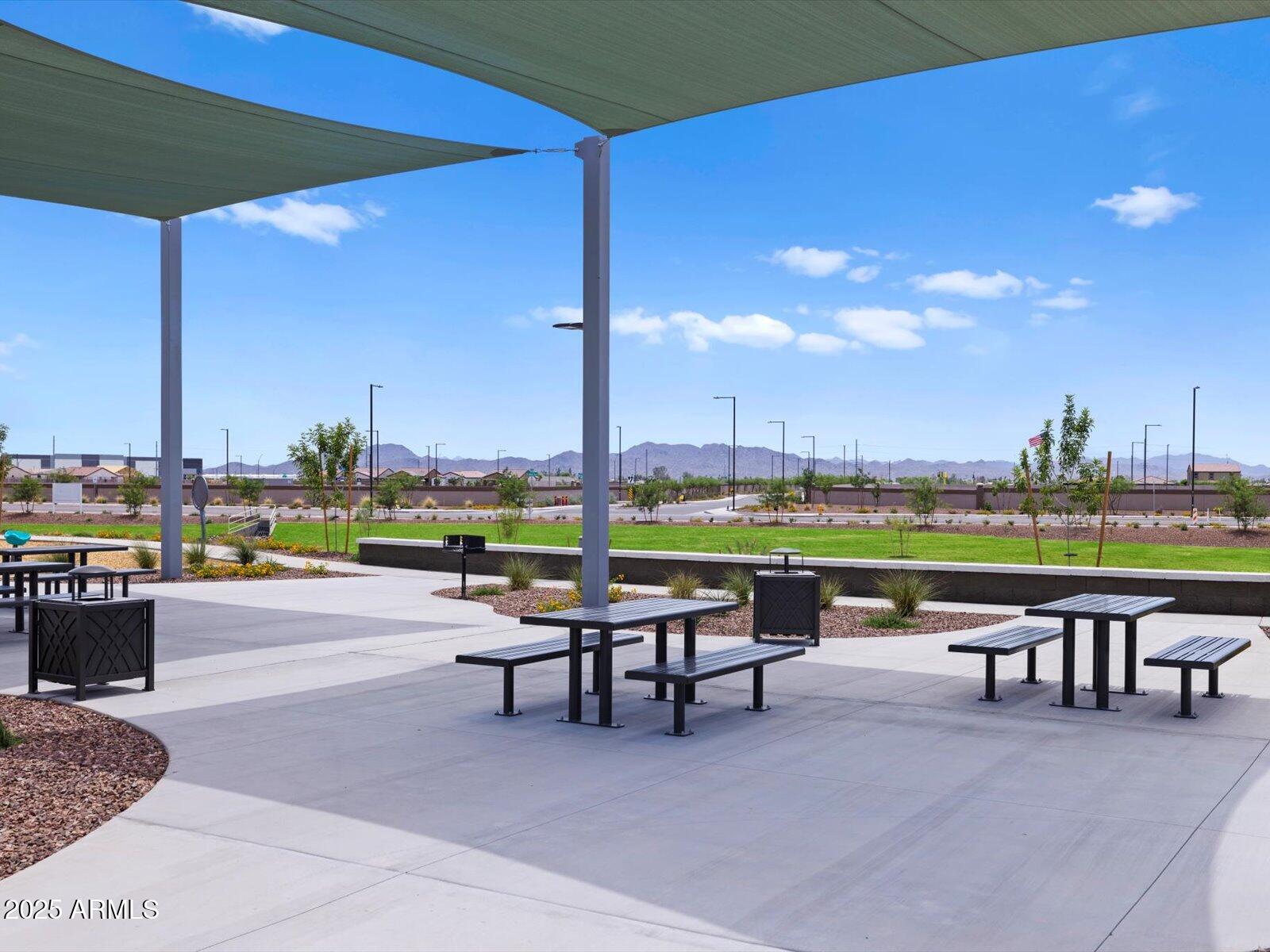 24477 West Grove Street Buckeye, AZ 85326 - Photo 45 of 49 a patio with a table and chairs