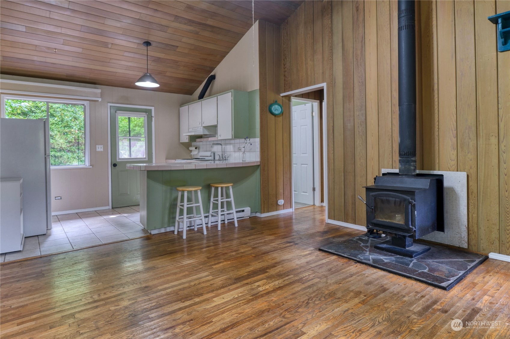 323 Mill Road Point Roberts, WA 98281 - Photo 4 of 26 a living room with furniture a fireplace and a table