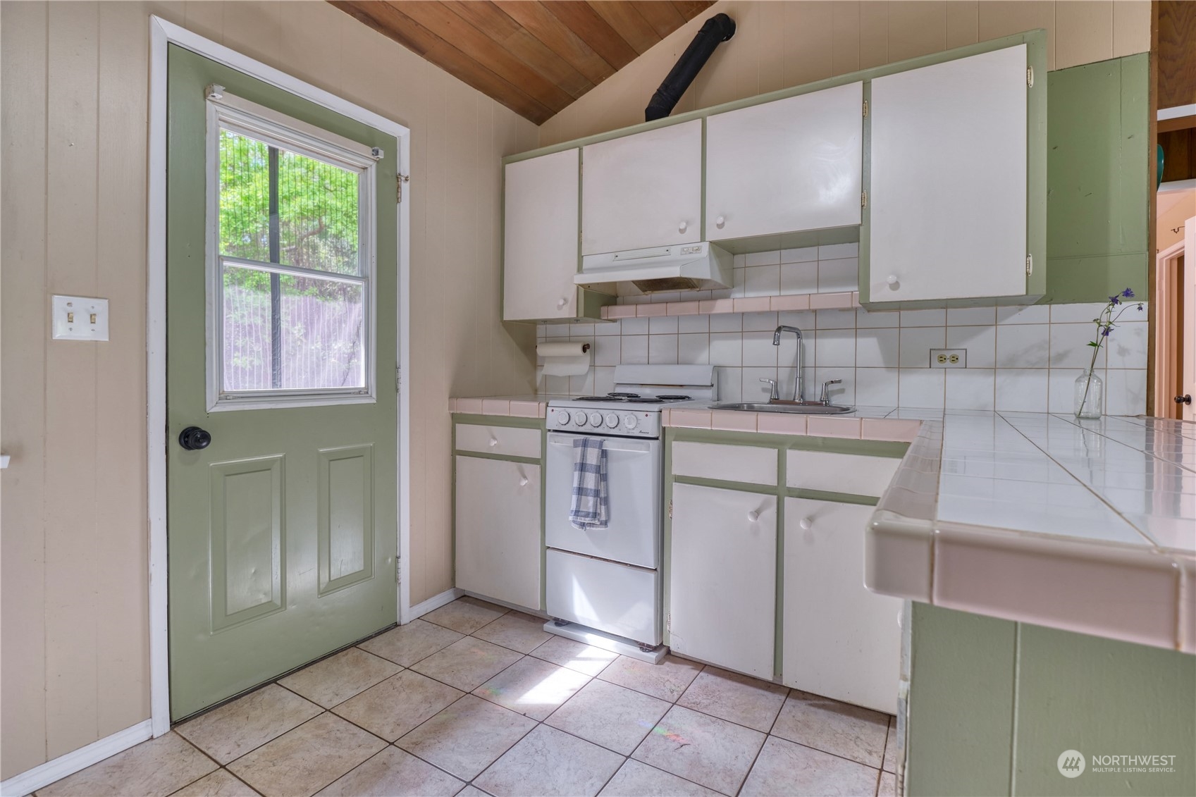 323 Mill Road Point Roberts, WA 98281 - Photo 5 of 26 a kitchen with stainless steel appliances granite countertop a sink stove and refrigerator