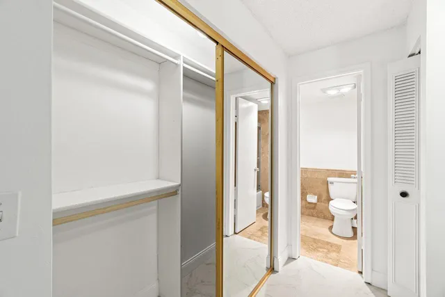 a view of a bathroom from a hallway