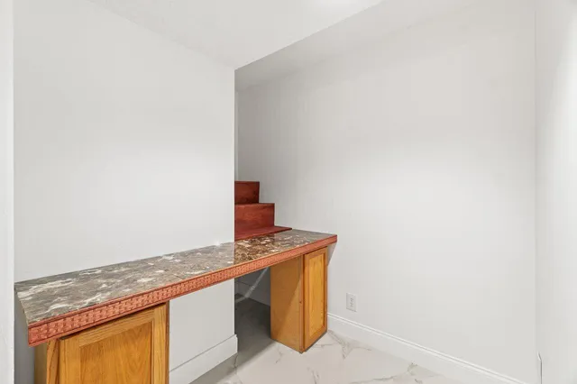 a kitchen with a sink and a microwave