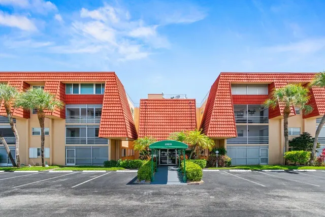 a view of a house with a yard and plants