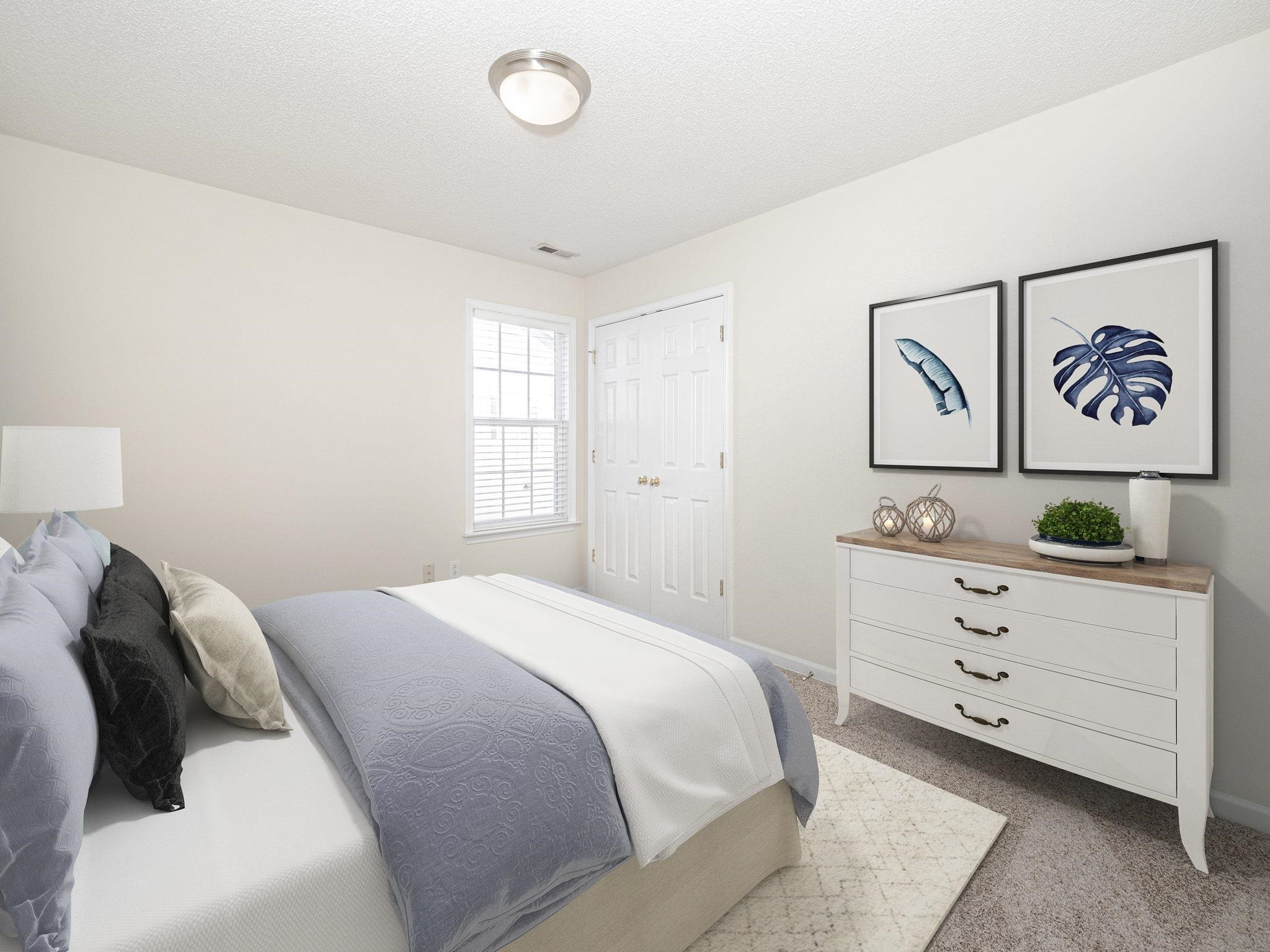 The secondary bedroom is a perfect guest room, or nursery. This home has been virtually staged. Secondary Bedroom
