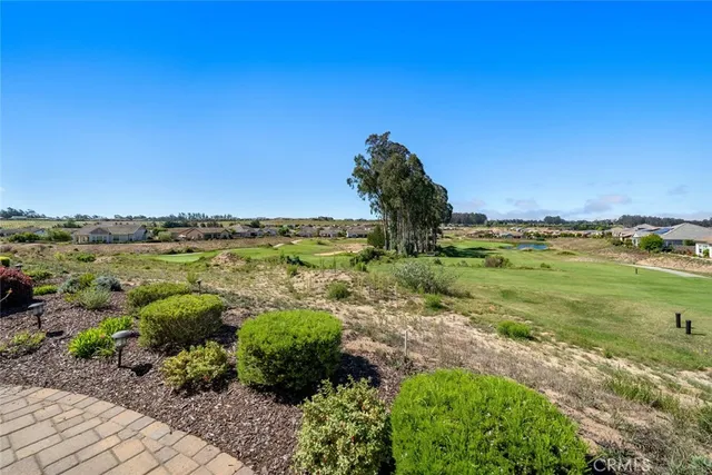 a bathroom with a shower sink and mirror