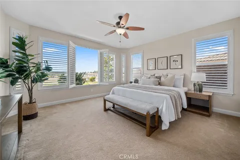 a living room with a bed furniture and a window